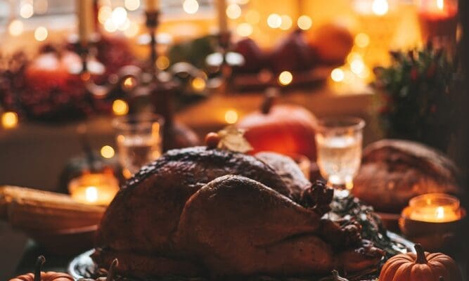 Thanksgiving,Day,Dinner,With,Holiday,Autumn,Decor,And,Candles.,Family